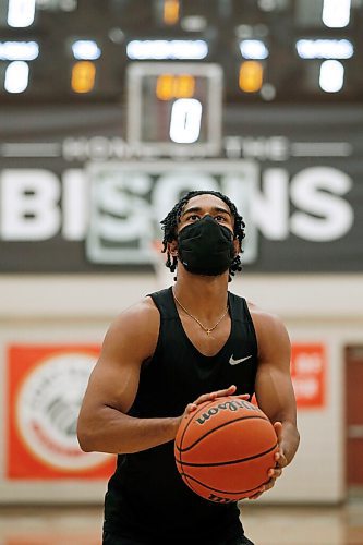 JOHN WOODS / WINNIPEG FREE PRESS
Keiran Zziwa, a U of MB Bison basketball player, throws some baskets at the university in Winnipeg Wednesday, June 23, 2021. Zziwa is heading to Morocco to play for Uganda at the Afro Basketball qualifier.

Reporter: Sawatzky