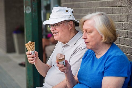 MIKAELA MACKENZIE / WINNIPEG FREE PRESS

Gerry and Joy Derek enjoy chocolate ice cream cones in Gimli on Friday, June 25, 2021. For Ben Waldman story.
Winnipeg Free Press 2021.