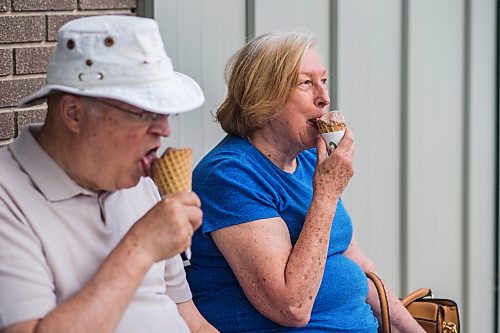 MIKAELA MACKENZIE / WINNIPEG FREE PRESS

Gerry and Joy Derek enjoy chocolate ice cream cones in Gimli on Friday, June 25, 2021. For Ben Waldman story.
Winnipeg Free Press 2021.