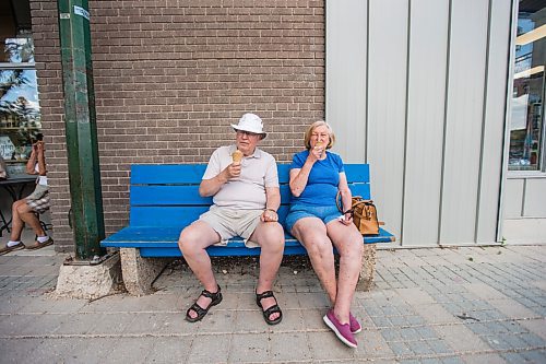 MIKAELA MACKENZIE / WINNIPEG FREE PRESS

Gerry and Joy Derek enjoy chocolate ice cream cones in Gimli on Friday, June 25, 2021. For Ben Waldman story.
Winnipeg Free Press 2021.