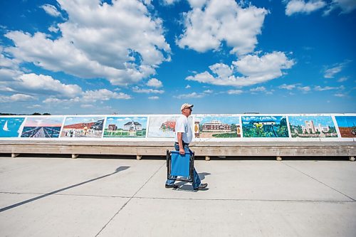 MIKAELA MACKENZIE / WINNIPEG FREE PRESS

Jim Krokosh walks down the pier to do some fishing in Gimli on Friday, June 25, 2021. For Ben Waldman story.
Winnipeg Free Press 2021.