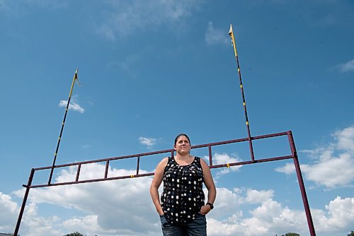 ALEX LUPUL / WINNIPEG FREE PRESS  

Jill Fast, Head Coach of the Portage Collegiate Institute Trojans Football team, poses for a portrait in Portage la Prairie on Friday, June 25, 2021. Fast is the first female head coach at the high school varsity level for the WHSFL football league.
