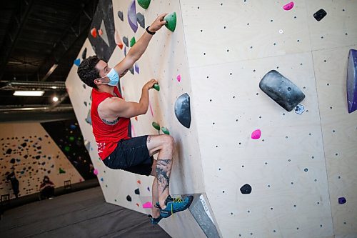 Daniel Crump / Winnipeg Free Press. Sam Beardsall, a Hive regular, climbs a boulder problem at the gym. The Hive is welcoming climbers through its doors once again after an easing of public health restrictions on Saturday. June 26, 2021.