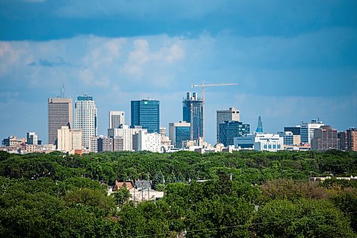 Daniel Crump / Winnipeg Free Press. Rainclouds hang over downtown Winnipeg, seen looking east from Westview Park. Storms have prompted weather warnings for parts of Southern Manitoba Saturday evening. June 26, 2021.