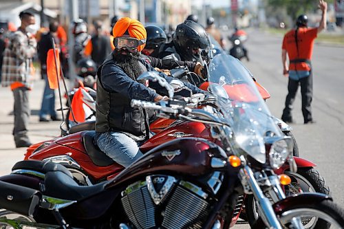 JOHN WOODS / WINNIPEG FREE PRESS
About 60-70 motorcycle riders get ready to hit the road to the residential school in Brandon from a business on Pembina Highway in Winnipeg Sunday, June 27, 2021. The group said the ride is a memorial for the children found in unmarked graves at  residential schools and to stand in solidarity with the Indigenous community.

Reporter: Standup