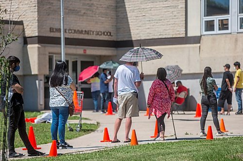 MIKAELA MACKENZIE / WINNIPEG FREE PRESS

Folks line up to get their shots at a pop-up vaccine clinic at Elwick Community School in Winnipeg on Monday, June 28, 2021. The site, which hoped to reach community members who might not otherwise easily be able to get their vaccine, had given out 123 of 150 Pfizer doses by noon. Standup.
Winnipeg Free Press 2021.