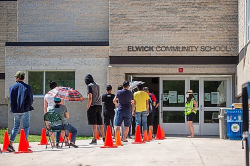 MIKAELA MACKENZIE / WINNIPEG FREE PRESS

Folks line up to get their shots at a pop-up vaccine clinic at Elwick Community School in Winnipeg on Monday, June 28, 2021. The site, which hoped to reach community members who might not otherwise easily be able to get their vaccine, had given out 123 of 150 Pfizer doses by noon. Standup.
Winnipeg Free Press 2021.