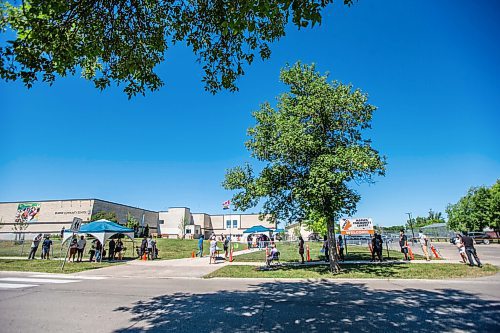 MIKAELA MACKENZIE / WINNIPEG FREE PRESS

Folks line up to get their shots at a pop-up vaccine clinic at Elwick Community School in Winnipeg on Monday, June 28, 2021. The site, which hoped to reach community members who might not otherwise easily be able to get their vaccine, had given out 123 of 150 Pfizer doses by noon. Standup.
Winnipeg Free Press 2021.