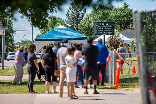 MIKAELA MACKENZIE / WINNIPEG FREE PRESS

Folks line up to get their shots at a pop-up vaccine clinic at Elwick Community School in Winnipeg on Monday, June 28, 2021. The site, which hoped to reach community members who might not otherwise easily be able to get their vaccine, had given out 123 of 150 Pfizer doses by noon. Standup.
Winnipeg Free Press 2021.