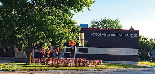 Canstar Community News Orange ribbons at École Viscount Alexander honour the remains of the 215 Indigenous children discovered at the former Kamloops Indian Residential School.