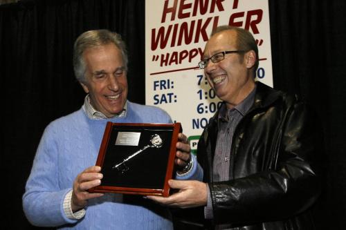 MIKE.DEAL@FREEPRESS.MB.CA 100328 - Sunday, March 28th, 2010 Winnipeg Mayor Sam Katz presents the key to the city to Henry Winkler who was in town at the World of Wheels Auto Show. Henry Winkler best known for his TV character "The Fonz" has also published over a dozen children's books and is an advocate for education and literacy. MIKE DEAL / WINNIPEG FREE PRESS
