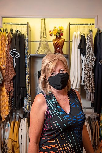 ALEX LUPUL / WINNIPEG FREE PRESS  

Janet Smith, co-owner of Appareo Fashion Boutique, poses for a portrait at her Winnipeg store located bellow the Fairmont Hotel on Tuesday, June 29, 2021. In Manitoba, small businesses remain in a precarious position, with only 35 per cent of stores making normal sales.