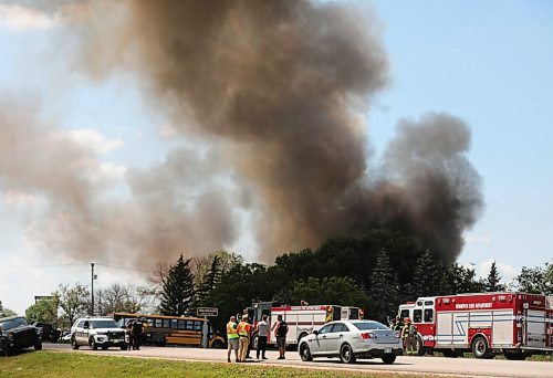 RUTH BONNEVILLE / WINNIPEG FREE PRESS

Local - Pool Pro Fire

Photo of City of Winnipeg Fire crews and trucks standing by as volunteer fire crews of the the RM of Macdonald fight the fire.  

Fire crews try to contain a large fire with billowing, black smoke at Pool Pros Ltd., located at 2595-B McGillivray Bvld. Wednesday.

The fire was called in around 1:20pm but took hours to contain and get under control.  Traffic along  McGillivray Bvld. Was blocked for several hours and business were closed early in the area for safety reasons. 

See story. 
JUNE 30, 2021