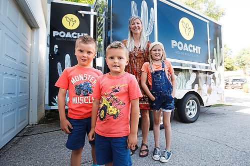 JOHN WOODS / WINNIPEG FREE PRESS
Erin Popoff, a former WestJet pilot laid off because of the pandemic, is photographed with her children Kodiak, 5, Makeiff, 7, and Olive, 9, and her new food truck trailer, Poacht, outside her home in Winnipeg Wednesday, June 30, 2021. Popoff launched the pandemic pivot small business to make up for being let go by WestJet.

Reporter: Durrani