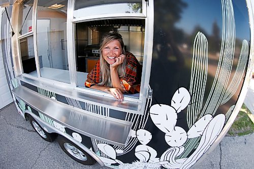 JOHN WOODS / WINNIPEG FREE PRESS
Erin Popoff, a former WestJet pilot laid off because of the pandemic, is photographed with her new food truck trailer, Poacht, outside her home in Winnipeg Wednesday, June 30, 2021. Popoff launched the pandemic pivot small business to make up for being let go by WestJet.

Reporter: Durrani