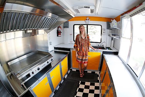 JOHN WOODS / WINNIPEG FREE PRESS
Erin Popoff, a former WestJet pilot laid off because of the pandemic, is photographed with her new food truck trailer, Poacht, outside her home in Winnipeg Wednesday, June 30, 2021. Popoff launched the pandemic pivot small business to make up for being let go by WestJet.

Reporter: Durrani