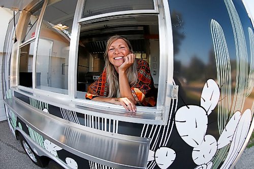 JOHN WOODS / WINNIPEG FREE PRESS
Erin Popoff, a former WestJet pilot laid off because of the pandemic, is photographed with her new food truck trailer, Poacht, outside her home in Winnipeg Wednesday, June 30, 2021. Popoff launched the pandemic pivot small business to make up for being let go by WestJet.

Reporter: Durrani