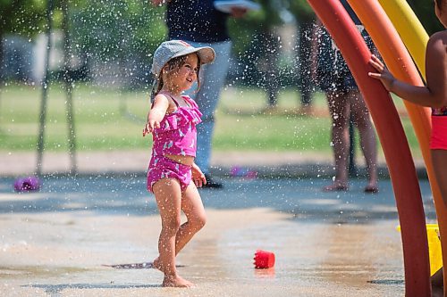 MIKAELA MACKENZIE / WINNIPEG FREE PRESS

Lyra Moore (three) keeps cool at the Provencher Park splash pad in Winnipeg on Friday, July 2, 2021. For Cody story.
Winnipeg Free Press 2021.