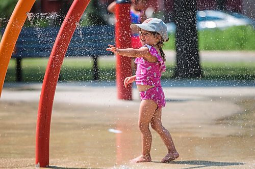 MIKAELA MACKENZIE / WINNIPEG FREE PRESS

Lyra Moore (three) keeps cool at the Provencher Park splash pad in Winnipeg on Friday, July 2, 2021. For Cody story.
Winnipeg Free Press 2021.