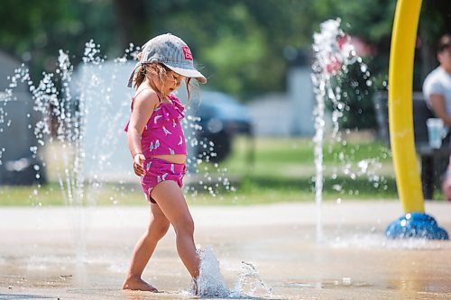 MIKAELA MACKENZIE / WINNIPEG FREE PRESS

Lyra Moore (three) keeps cool at the Provencher Park splash pad in Winnipeg on Friday, July 2, 2021. For Cody story.
Winnipeg Free Press 2021.