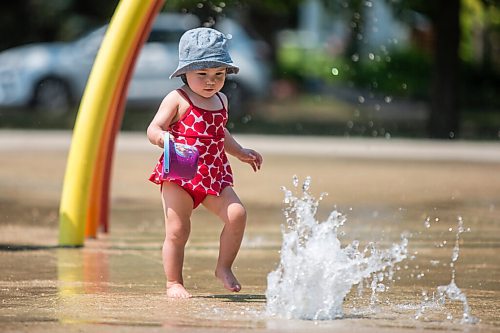 MIKAELA MACKENZIE / WINNIPEG FREE PRESS

One-year-old London Malegus explores the water features for the first time at the Provencher Park splash pad in Winnipeg on Friday, July 2, 2021. For Cody story.
Winnipeg Free Press 2021.