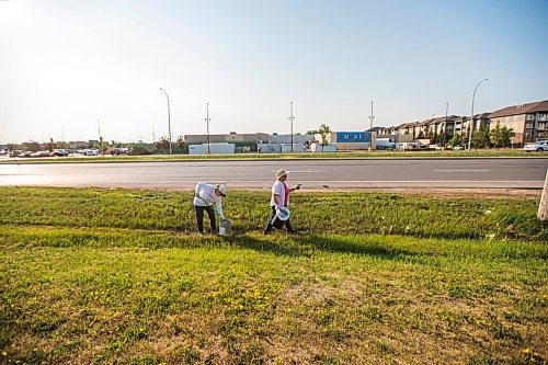 MIKAELA MACKENZIE / WINNIPEG FREE PRESS

Reisa Adelman (left) and Elaine Arsenault-Schultz clean the ditch up at Mcgillivray and Kenaston in Winnipeg on Friday, July 2, 2021. The two volunteer their time with Take Pride Winnipeg, picking up garbage throughout our city to help beautify the community. For Aaron Epp story.
Winnipeg Free Press 2021.