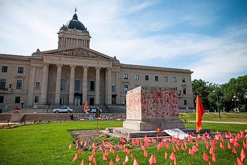Daniel Crump / Winnipeg Free Press. An empty stone base remains, covered in red handprints, where a large statue of queen Victoria once stood in front of the Manitoba legislature. The statue was pulled down by indigenous protestors following a march honouring the survivors and victims of residential schools. July 3, 2021.