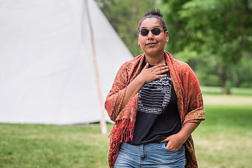 MIKAELA MACKENZIE / WINNIPEG FREE PRESS

Aaliyah Leach, coordinator, poses for a portrait at the sacred fire and healing village on the Legislative grounds in Winnipeg on Monday, July 5, 2021. For Carol Sanders story.
Winnipeg Free Press 2021.