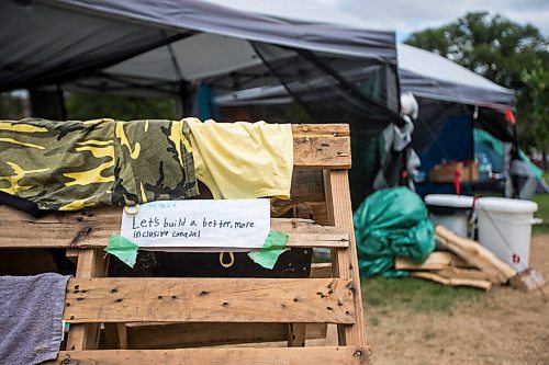 MIKAELA MACKENZIE / WINNIPEG FREE PRESS

A note on the clothes drying rack at the sacred fire and healing village on the Legislative grounds in Winnipeg on Monday, July 5, 2021. For Carol Sanders story.
Winnipeg Free Press 2021.