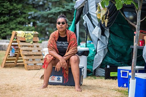 MIKAELA MACKENZIE / WINNIPEG FREE PRESS

Aaliyah Leach, coordinator, poses for a portrait at the sacred fire and healing village on the Legislative grounds in Winnipeg on Monday, July 5, 2021. For Carol Sanders story.
Winnipeg Free Press 2021.