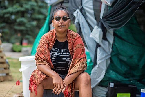 MIKAELA MACKENZIE / WINNIPEG FREE PRESS

Aaliyah Leach, coordinator, poses for a portrait at the sacred fire and healing village on the Legislative grounds in Winnipeg on Monday, July 5, 2021. For Carol Sanders story.
Winnipeg Free Press 2021.