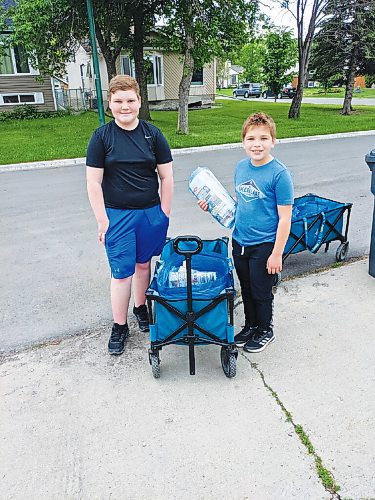 Canstar Community News Dylan (left) and William Dixon have been delivering The Lance in River Park South for the past 18 months.