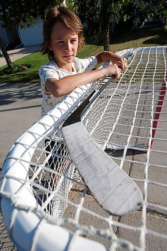 JOHN WOODS / WINNIPEG FREE PRESS
Ryden Leronowich, 10, a Grade 4 student is photographed outside his home in Winnipeg Monday, July 5, 2021. Leronowich contributed a piece of poetry about his love for hockey and missing the sport during COVID-19 to an anthology, Apart, Yet Together, which will be distributed by the Seven Oaks School Division.

Reporter: MacIntosh