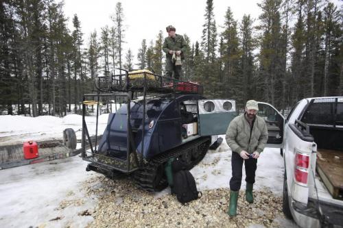 BORIS.MINKEVICH@FREEPRESS.MB.CA BORIS MINKEVICH / WINNIPEG FREE PRESS  100309 Wood Bison at Chitek Lake.  Manitoba Conservation natural resource officer Gord Kirbyson (top) and Brian Joynt is Manitoba Conservation wildlife manager for the central region load up the Bombardier that will take us to the cabin near the bison area.