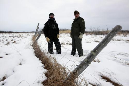 BORIS.MINKEVICH@FREEPRESS.MB.CA BORIS MINKEVICH / WINNIPEG FREE PRESS  100309 Wood Bison at Chitek Lake.  Manitoba Conservation natural resource officer Gord Kirbyson (right) and Brian Joynt is Manitoba Conservation wildlife manager for the central region stand at the original fenced pen area where the bison were released.