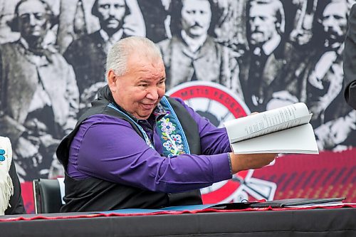 MIKAELA MACKENZIE / WINNIPEG FREE PRESS

Manitoba Metis Federation (MMF) president David Chartrand shows the agreement, which gives the MMF formal recognition to lead the Manitoba Metis and represent them, at a signing ceremony at Upper Fort Garry Heritage Provincial Park in Winnipeg on Tuesday, July 6, 2021. For Carol Sanders story.
Winnipeg Free Press 2021.