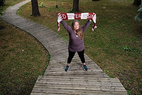 ALEX LUPUL / WINNIPEG FREE PRESS  

Nicky Cottee, president of the Valour FC fan club Red River Rising, poses for a portrait at her Winnipeg home on Tuesday, July 6, 2021. The Canadian Premier League will welcome 2,000 fans to IG field starting Wednesday.

Reporter: Taylor Allen