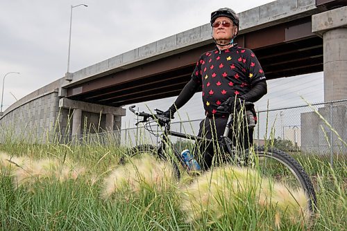 ALEX LUPUL / WINNIPEG FREE PRESS  

Jeff Malcovish poses for a portrait behind patches of foxtail, a weed that can dangerous to animals, along the transitway in Winnipeg on Tuesday, July 6, 2021.

Reporter: Taylor Allen