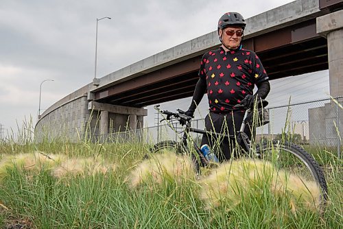 ALEX LUPUL / WINNIPEG FREE PRESS  

Jeff Malcovish poses for a portrait behind patches of foxtail, a weed that can dangerous to animals, along the transitway in Winnipeg on Tuesday, July 6, 2021.

Reporter: Taylor Allen