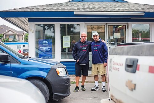 MIKAELA MACKENZIE / WINNIPEG FREE PRESS

Cousins Trif (left) and Dean Lambos pose for a portrait in front of the Dairi-Wip Drive In, one of the more iconic burger joints in town, in Winnipeg on Tuesday, July 6, 2021. For Dave Sanderson story.
Winnipeg Free Press 2021.