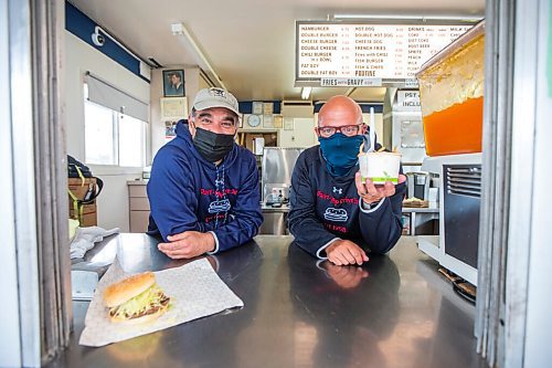 MIKAELA MACKENZIE / WINNIPEG FREE PRESS

Cousins Dean (left) and Trif Lambos pose for a portrait at the Dairi-Wip Drive In, one of the more iconic burger joints in town, in Winnipeg on Tuesday, July 6, 2021. For Dave Sanderson story.
Winnipeg Free Press 2021.