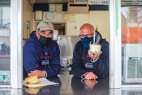 MIKAELA MACKENZIE / WINNIPEG FREE PRESS

Cousins Dean (left) and Trif Lambos pose for a portrait at the Dairi-Wip Drive In, one of the more iconic burger joints in town, in Winnipeg on Tuesday, July 6, 2021. For Dave Sanderson story.
Winnipeg Free Press 2021.