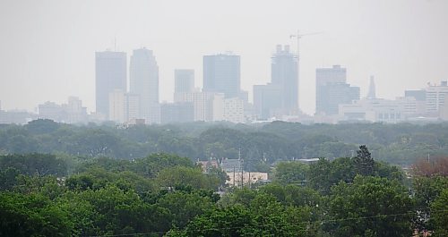 MIKE DEAL / WINNIPEG FREE PRESS
Smoke from forest fires east of Berens River and west of Red Lake hang over downtown Winnipeg Tuesday afternoon.
210706 - Tuesday, July 06, 2021.