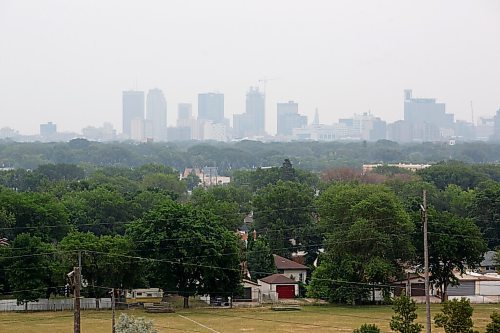 MIKE DEAL / WINNIPEG FREE PRESS
Smoke from forest fires east of Berens River and west of Red Lake hang over downtown Winnipeg Tuesday afternoon.
210706 - Tuesday, July 06, 2021.