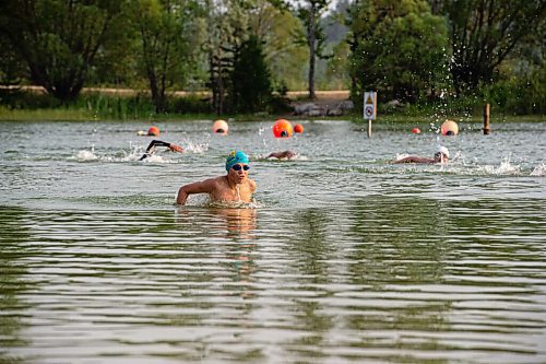 MIKE SUDOMA / WINNIPEG FREE PRESS
Turk Dingwall leads the group as he finishes a swim lap during a Triathlon Manitoba practice in Birds Hill Park Tuesday evening 
July 6, 2021