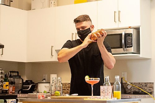 MIKE SUDOMA / Winnipeg Free Press
Bartender, Scott Redfern, creates two new summer cocktails at his home Wednesday afternoon
July 7, 2021