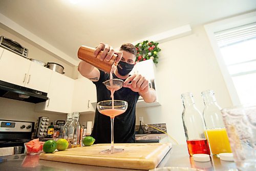 MIKE SUDOMA / Winnipeg Free Press
Bartender, Scott Redfern, creates two new summer cocktails at his home Wednesday afternoon
July 7, 2021