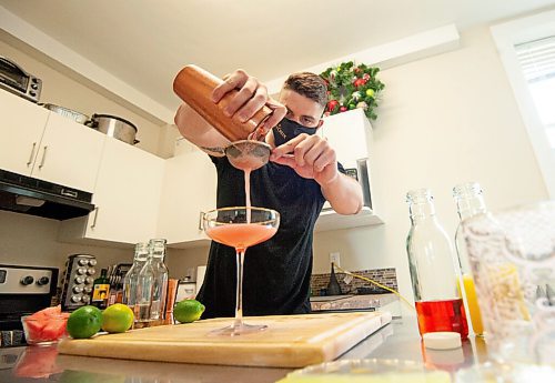 MIKE SUDOMA / Winnipeg Free Press
Bartender, Scott Redfern, creates two new summer cocktails at his home Wednesday afternoon
July 7, 2021