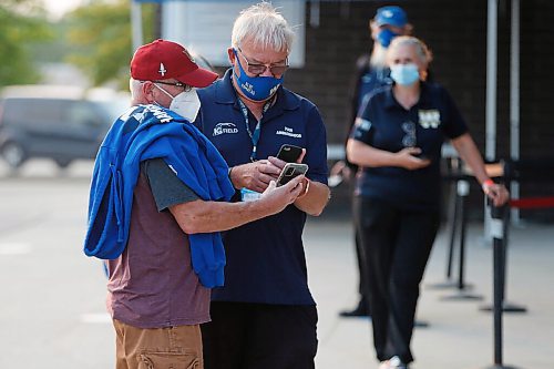 JOHN WOODS / WINNIPEG FREE PRESS
Valour football fans line up to get their vaccination cards/QR codes scanned before they enter the stadium in Winnipeg Wednesday, July 7, 2021.

Reporter: ?