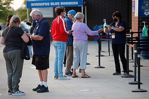 JOHN WOODS / WINNIPEG FREE PRESS
Valour football fans line up to get their vaccination cards/QR codes scanned before they enter the stadium in Winnipeg Wednesday, July 7, 2021.

Reporter: ?